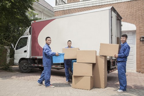 Van moving through a busy Hampstead road near local properties