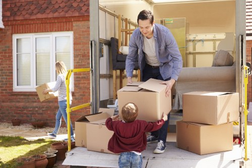 Removal team planning a Hampstead house move with boxes and furniture