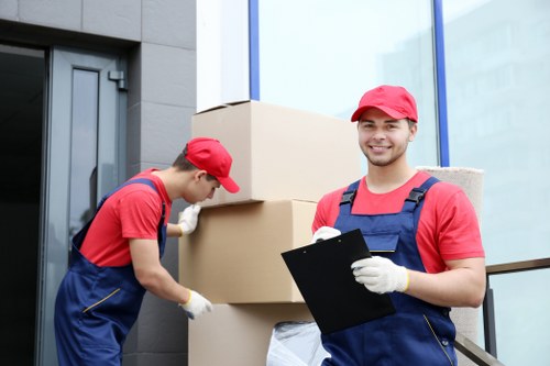Specialist piano moving team navigating a Hampstead property