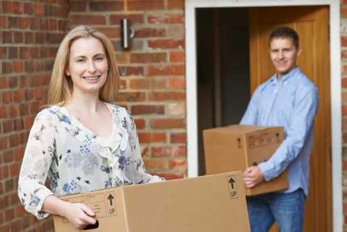 Movers handling furniture carefully in a Hampstead property