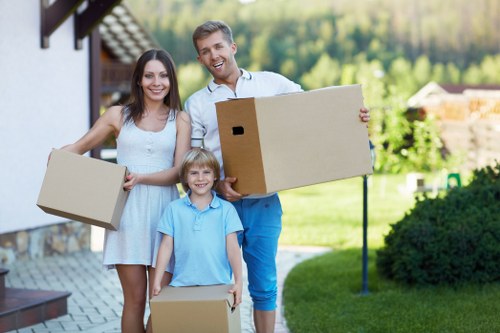 Careful loading of household items during a Hampstead urgent move