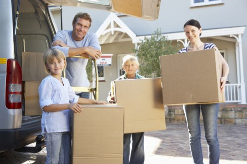 Loading furniture and boxes into a removal truck in Hampstead