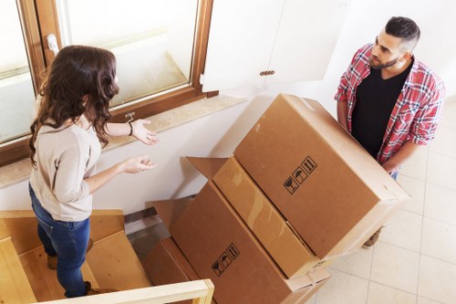 Hampstead moving team handling household belongings with a practical van service