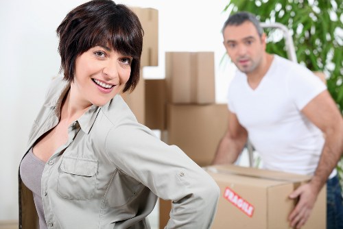 Team member lifting furniture with proper technique