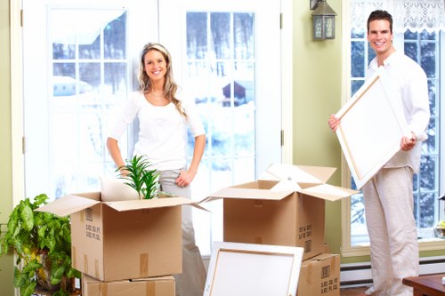 Local man with van in Hampstead handling household moving items carefully