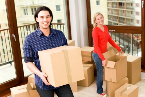Professional movers handling furniture in a Hampstead property